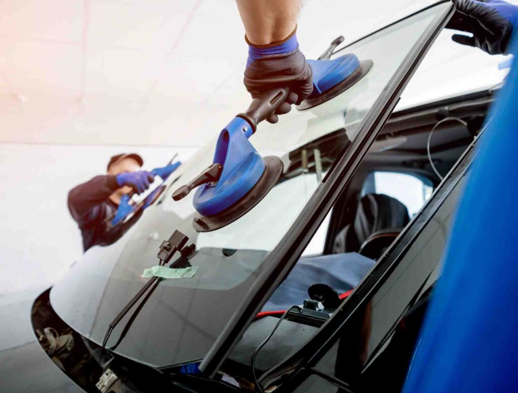 Technicians Replacing Windshield – Zamora’s Auto Body Collision Repair Services – Frederick MD Technicians Replacing Windshield - Zamora's Auto Body Collision Repair Services - Frederick MD